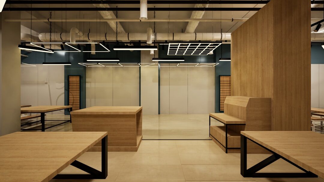 Journalists working at desks in a small newsroom office