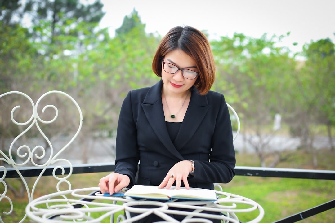 Studio portrait of a Swiss woman in her thirties with blonde hair, business journalist